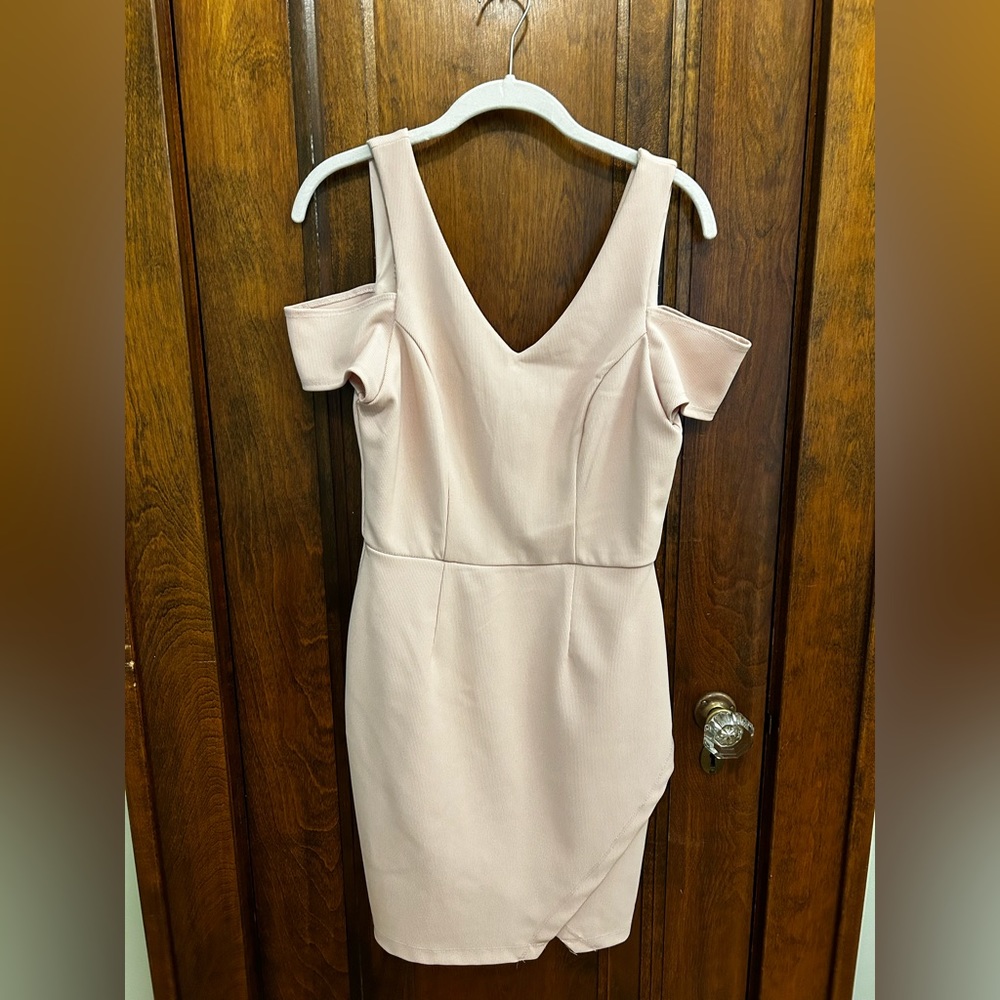 Light pink dress with sparkling fabric and slit with off the shoulder cut outs.